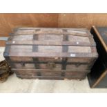 A DOME TOPPED VINTAGE WOODEN STORAGE CHEST