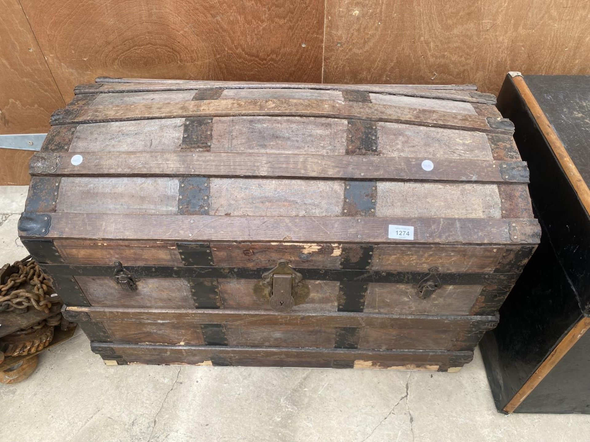 A DOME TOPPED VINTAGE WOODEN STORAGE CHEST