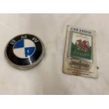 A VINTAGE WALES ENAMEL BUMPER BADGE AND A BMW BADGE