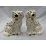 A PAIR OF STAFFORDSHIRE MANTLE DOGS