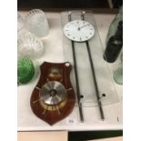 A CHROME AND GLASS WALL CLOCK 18CM X 62CM PLUS A MAHOGANY CASED BAROMETER