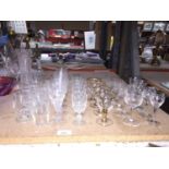 A QUANTITY OF GLASSES TO INCLUDE ETCHED AND CUT GLASS SHERRY, PORT, LICQUOR, ETC