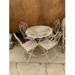 A DECORATIVE WROUGHT IRON BISTRO SET COMPRISING OF A ROUND TABLE AND FOUR CHAIRS