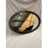 A LARGE MAHOGANY FRAMED OVAL MIRROR WITH BEADED INNER APPROX 100CM X 65CM