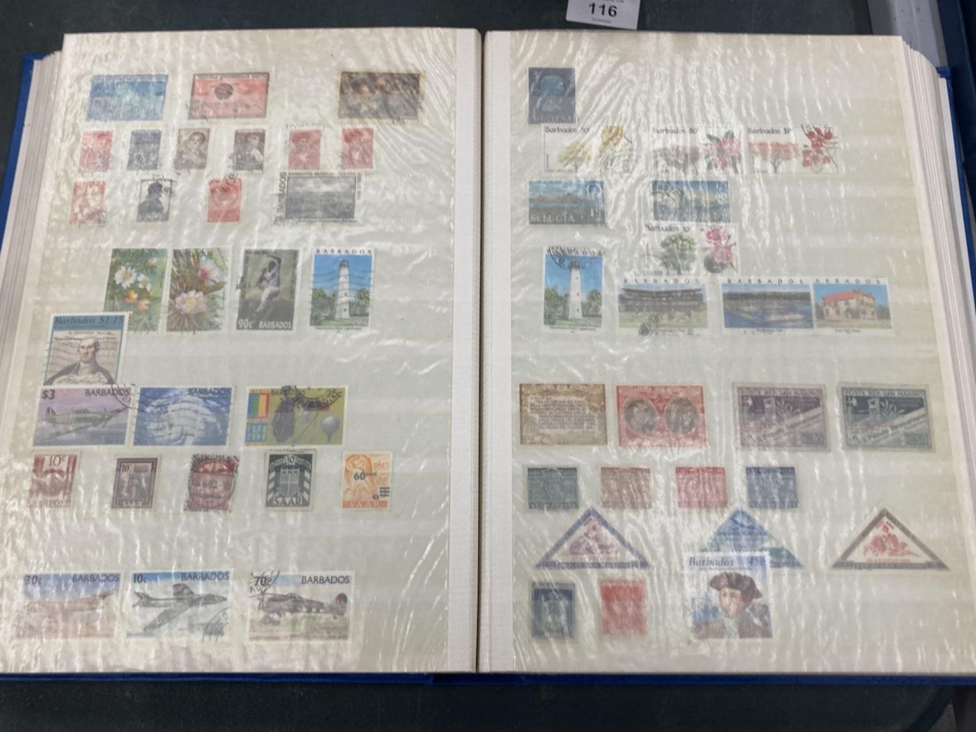 A STAMP ALBUM OF INTERNATIONAL STAMPS TO INCLUDE SWITZERLAND, SOUTH AFRICA, NORWAY, BARBADOS,