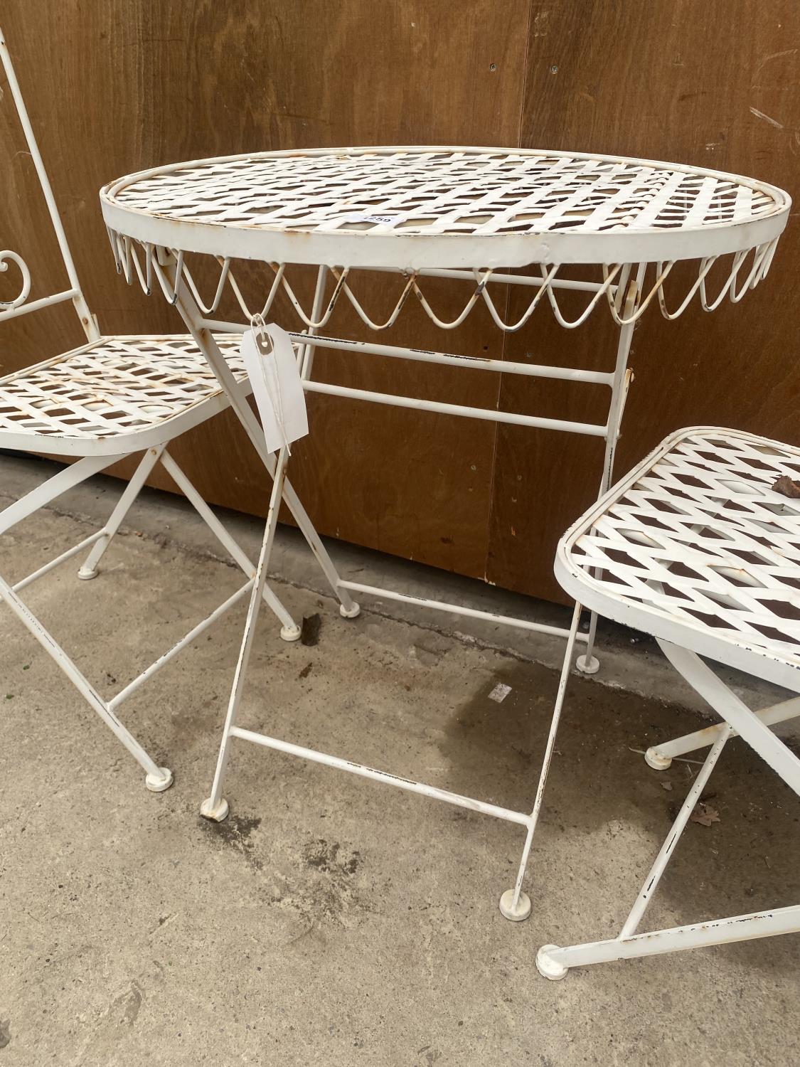 A DECORATIVE WROUGHT IRON BISTRO SET COMPRISING OF A ROUND TABLE AND TWO CHAIRS - Image 3 of 5