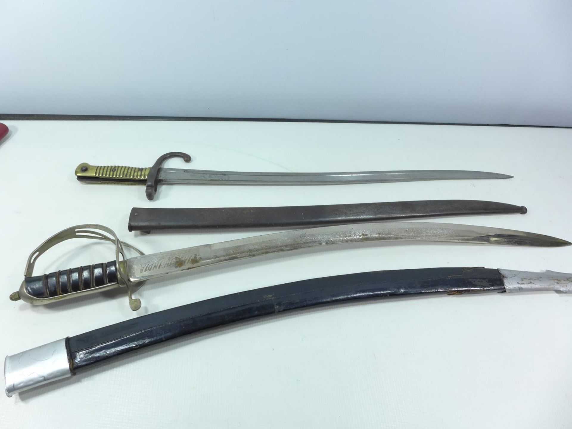 A FRENCH LATE 19TH CENTURY CHASSEPOT BAYONET WITH SCABBARD AND AN INDIAN SWORD WITH SCABBARD - Image 2 of 4