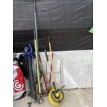 AN ASSORTMENT OF GARDEN TOOLS TO INCLUDE A LEAF BLOWER, SHEARS AND A PICK AXE ETC