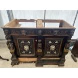 A VICTORIAN OAK HEAVILY CARVED BOOKCASE BASE WITH APPLIED CARVINGS OF ROBED LADIES AND LION MASKS,