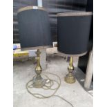 A PAIR OF DECORATRIVE GILT TABLE LAMPS WITH BLACK SHADES