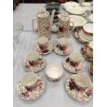A BESWICK ROSE PATTERNED COFFEE SET WITH COFFEE POT, HOT WATER JUG, COFFEE CANS AND SAUCERS AND