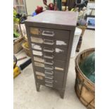 A TEN DRAWER MINITURE METAL FILING CABINET