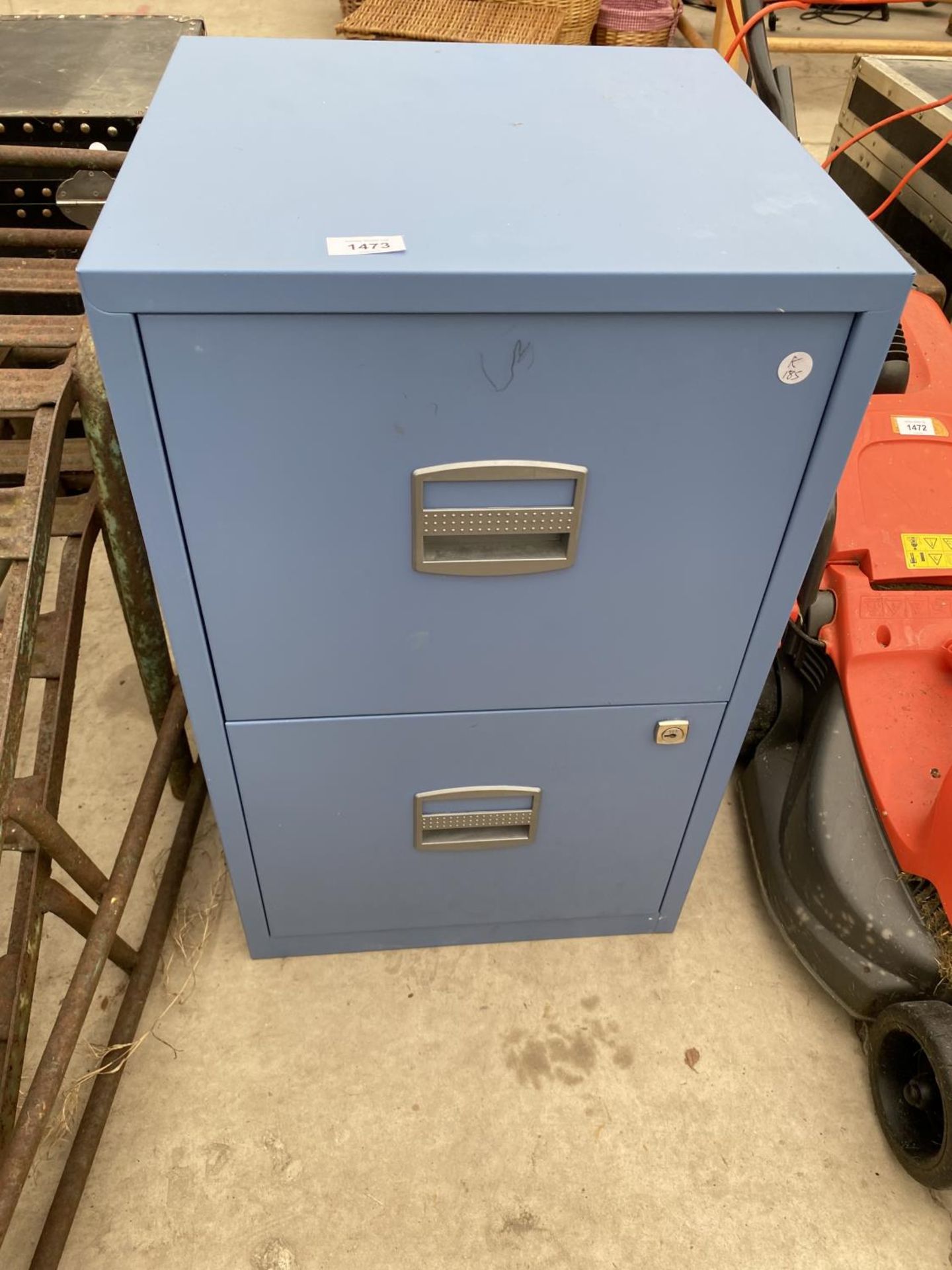 A BLUE METAL TWO DRAWER FILING CABINET