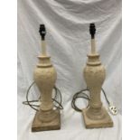 A PAIR OF CREAM STONE LAMPS WITH SHADES - HEIGHT 54CM