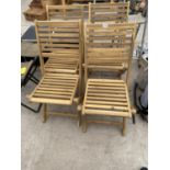 A SET OF FOUR NEW TEAK FOLDING GARDEN CHAIRS