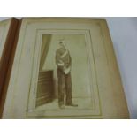 A LATE 19TH CENTURY PHOTO ALBUM WITH THREE PHOTOS OF SOLDIERS IN UNIFORM