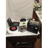 A RECORD CASE CONTAINING A QUANTITY OF 1970'S AND 80'S SINGLES TO INCLUDE ROXY MUSIC, ADAM AND THE