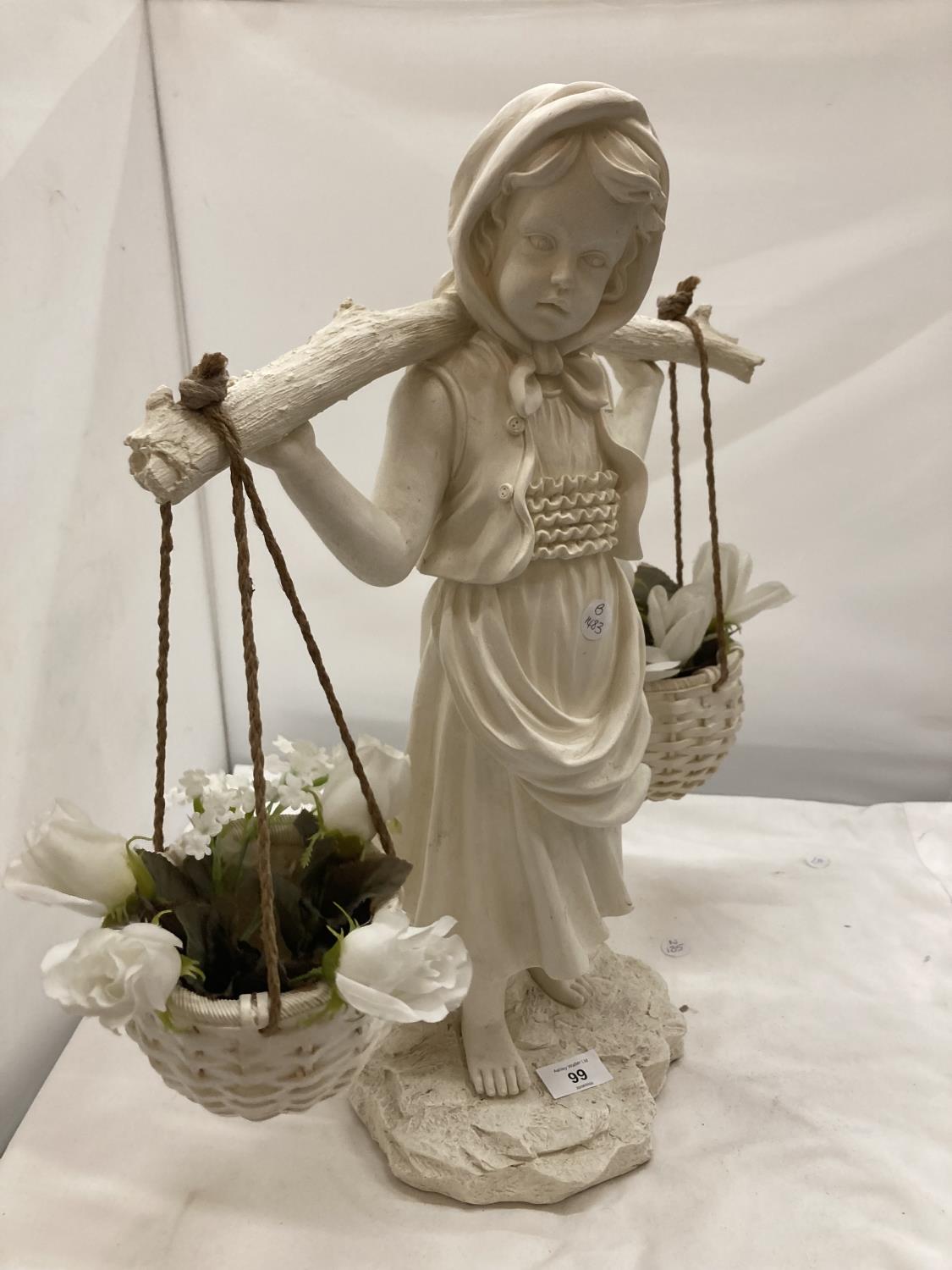 A LARGE CREAM COLOURED FIGURE OF A GIRL CARRYING BASKETS OF FLOWERS HEIGHT 53CM