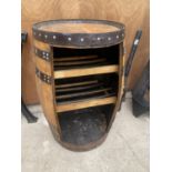 A LARGE OAK WHISKEY BARRELL CONVERTED TO A STORAGE UNIT