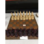 A CHESS BOARD WITH EROTIC CHESS PIECES