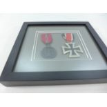 A FRAMED NAZI MEDAL IRON CROSS SECOND CLASS AND A NAZI EASTERN FRONT MEDAL