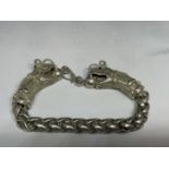 A LOW GRADE SILVER DRAGON BRACELET