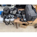 A LARGE ASSORTMENT OF CAMERA EQUIPMENT TO INCLUDE AN OLYMPUS E-410 CAMERA, FLASHES, FURTHER