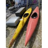 TWO FIBRE GLASS CANOES ONE WITH A PADDLE