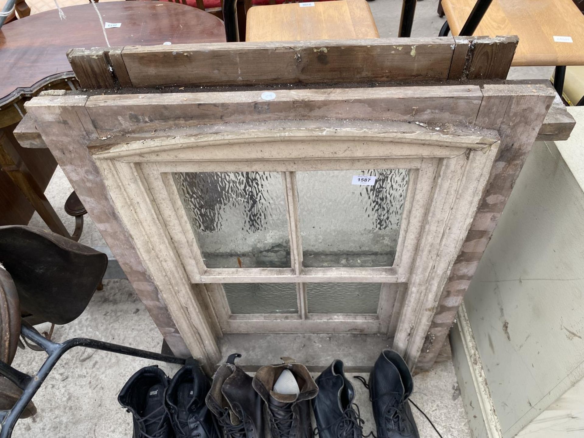 A VINTAGE WOODEN FRAMED SLIDING WINDOW