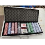 A BOXED POKER SET WITH CHIPS AND DECKS OF CARDS