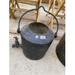 A VINTAGE CAST IRON CAULDRON/KETTLE WITH TAP TO BASE