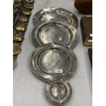 A SET OF FOUR ANTIQUE PEWTER PLATES WITH TOUCH MARKS, DIAMETER LARGEST 35CM, SMALLEST 11.5CM