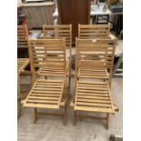 A SET OF FOUR NEW TEAK FOLDING GARDEN CHAIRS