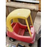 A RED AND YELLOW LITTLE TIKES COZY COUPE CAR