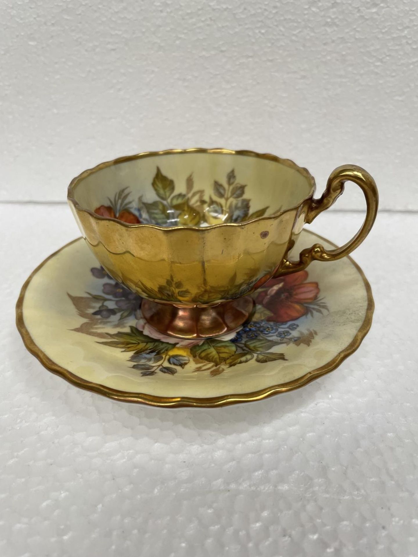 AN AYNSLEY J A BAILEY CABINET CUP AND SAUCER
