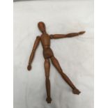 AN EARLY WOODEN ARTICULATED FIGURE HEIGHT APPROX 31CM