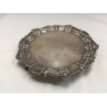 A HALLMARKED BIRMINGHAM SILVER TRAY WITH PIE CRUST EDGE AND THREE BALL AND CLAW FEET GROSS WEIGHT