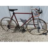 A VINTAGE ROAD RACING BIKE WITH 5 SPEED GEAR SYSTEM