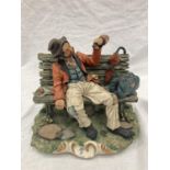 A CAPODIMONTE FIGURINE OF A DRUNKEN MAN ON A BENCH