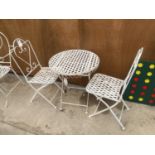 A DECORATIVE WROUGHT IRON BISTRO SET COMPRISING OF A ROUND TABLE AND TWO CHAIRS