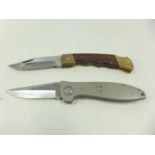 TWO FOLDING KNIVES AND SCABBARDS 9.5 CM BLADES