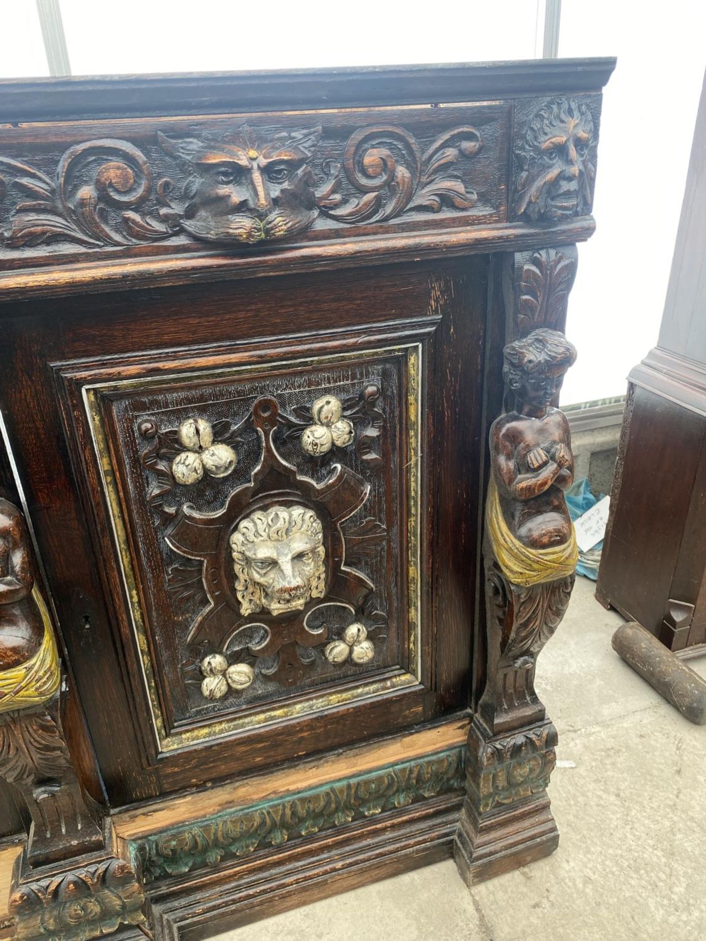 A VICTORIAN OAK HEAVILY CARVED BOOKCASE BASE WITH APPLIED CARVINGS OF ROBED LADIES AND LION MASKS, - Image 3 of 6