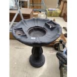 A PLASTIC BIRD BATH STYLE WATER FEATURE BASE