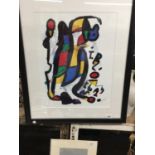 A COLOURFUL ABSTRACT PRINT INSET IN A WHITE BORDER AND BLACK FRAME - 27 X 23 CM