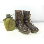 A PAIR OF BROWN LEATHER BOOTS, SIZE 43M AND A WATER BOTTLE