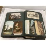 A LARGE QUANTITY OF VINTAGE POSTCARDS IN AN ALBUM