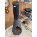 A DECORATIVE METAL GARDEN CHIMENEA