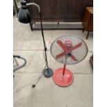 A FLOOR FAN AND A STANDARD LAMP