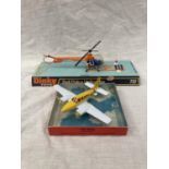 A VINTAGE DINKY TOYS BELL POLICE HELICOPTER IN ORIGINAL BLISTER PACK AND A LINTOY PIPER NAVAJO IN