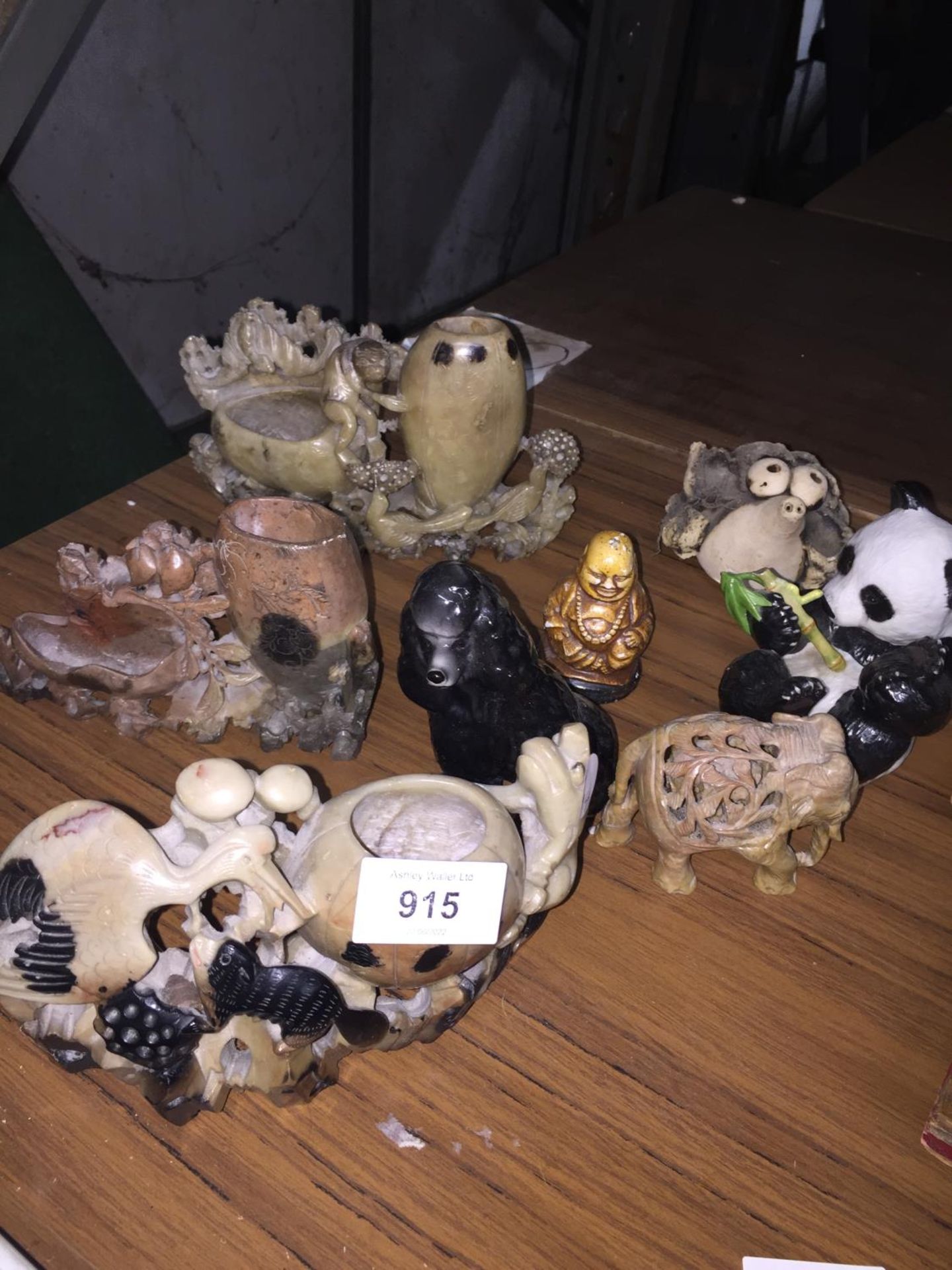 A COLLECTION OF POTTERY AND CERAMICS TO INCLUDE ANIMAL FIGURES, BUDDAH, SOAPSTONE CARVINGS, ETC